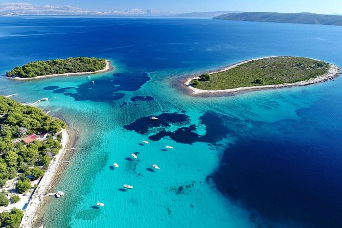 Blue Lagoon, Trogir & Čiovo catamaran tour with Food and Drinks - Blue Lagoon and Krknjaši Bay: the first swim