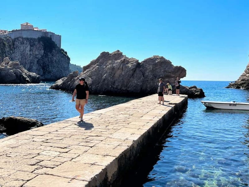 Dubrovnik: City Walls, Old Town Walking Tour & Adriatic View - Old City Harbor and the shift from street to sea