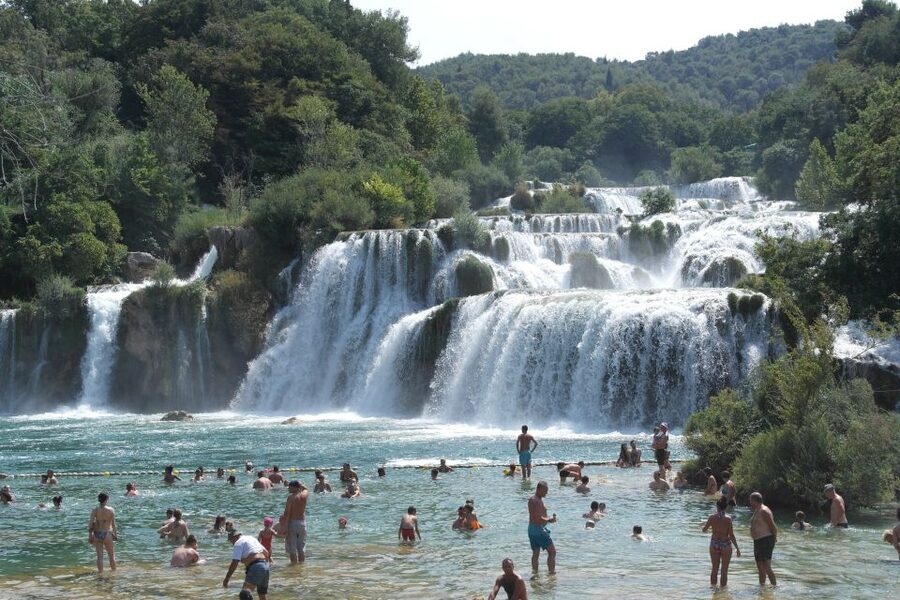 From Omiš: Krka Waterfalls and Trogir Small Group Tour - Walking beside Skradinski Buk