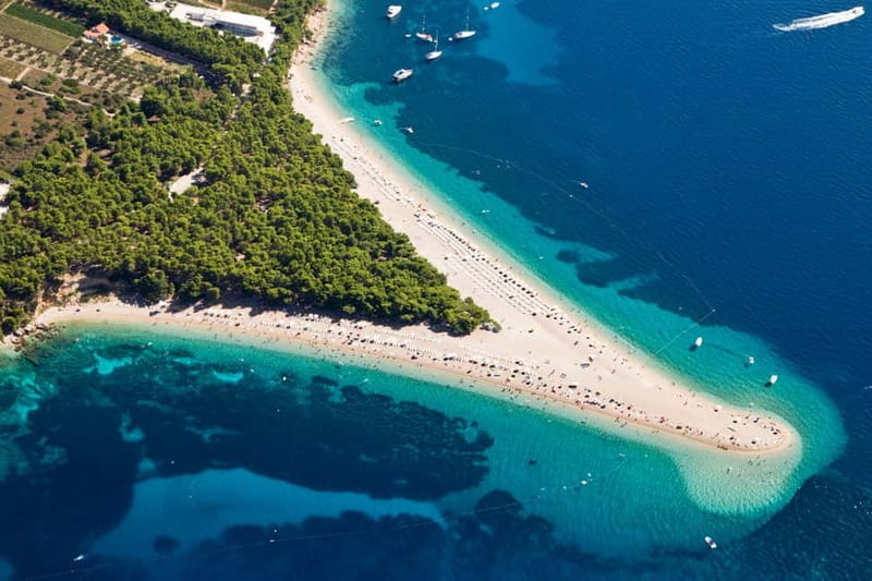 From Split: Catamaran Cruise to Golden Horn & Brač island. - Music, fruit, and the sunset ride to Split