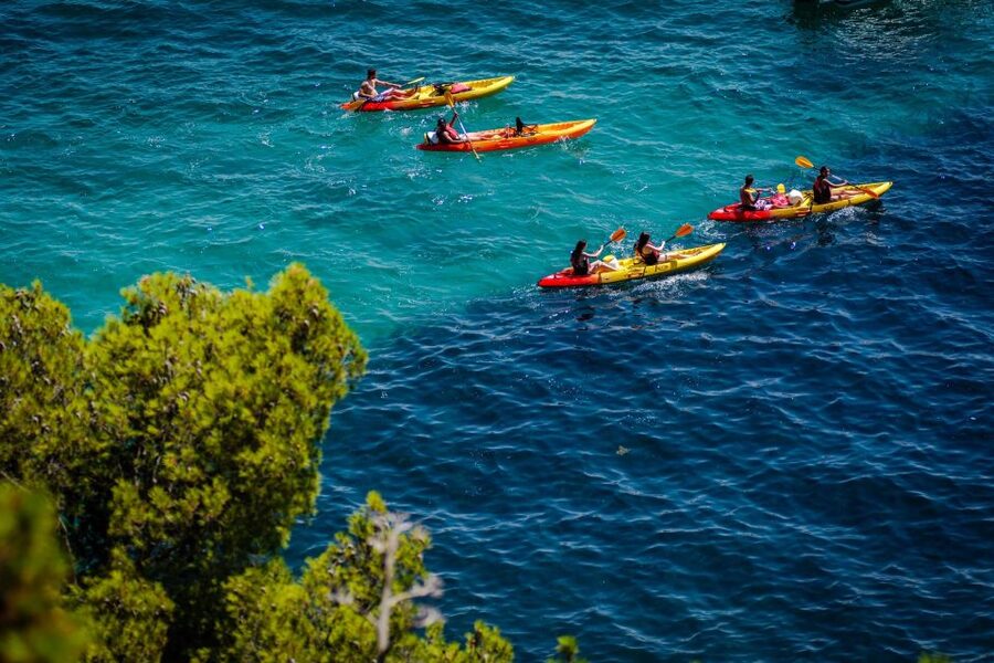 From Split: Sea Kayaking Tour - Kasjuni Beach for swimming, snorkeling, and cliff jumping
