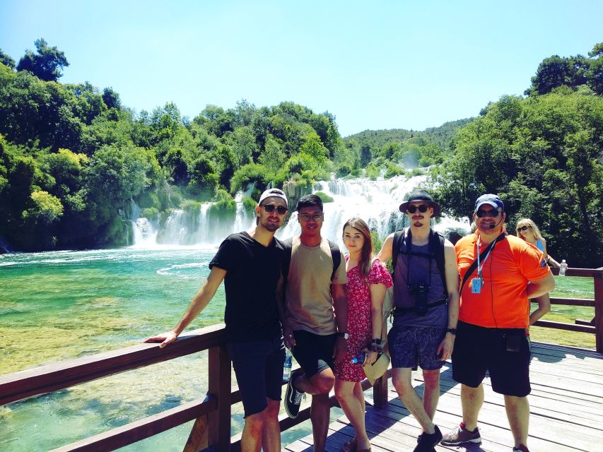 From Split & Trogir: Krka Waterfalls Day Tour with Boat Ride - Skradin: lunch, harbor views, and a cool dip