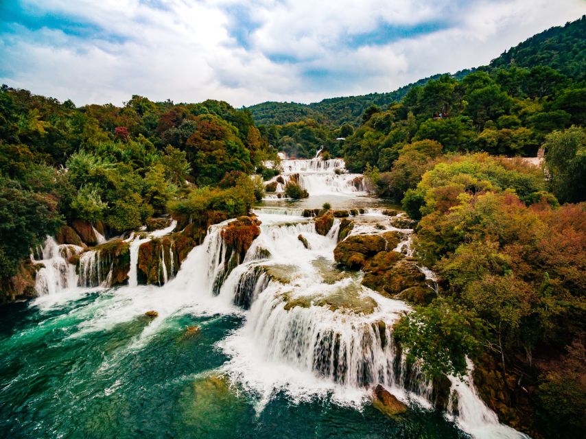 From Split & Trogir: Krka Waterfalls Day Tour with Boat Ride - Entering Krka National Park and paying the real cost