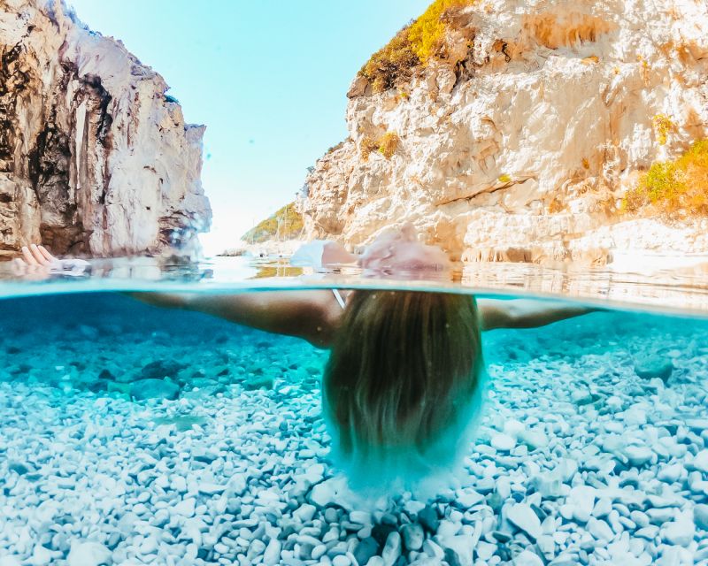 From Trogir or Split: Full-Day Blue Cave & Hvar Island Tour - Komiža gives the day a human center