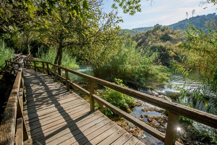 From Trogir, Seget & Okrug: Krka Waterfalls Gastro Tour - A 30-minute boat ride down the Krka River