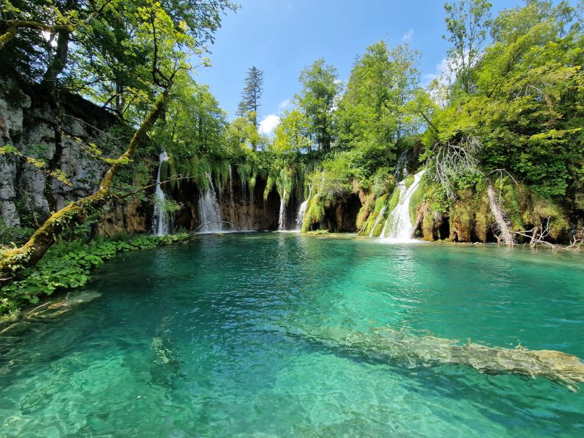 From Zadar: Krka Waterfalls Tour with Panoramic Boat Ride - Walking the Wooden Paths Around the Waterfalls