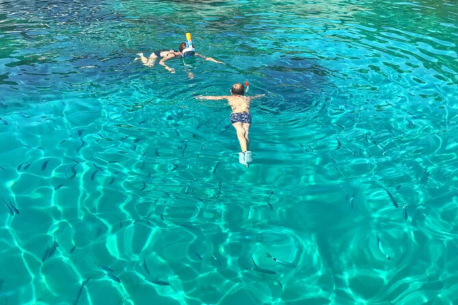 Half Day Speedboat Tour to Three Islands from Trogir - Blue Lagoon and Krknjaši Bay: beautiful water, busy shore