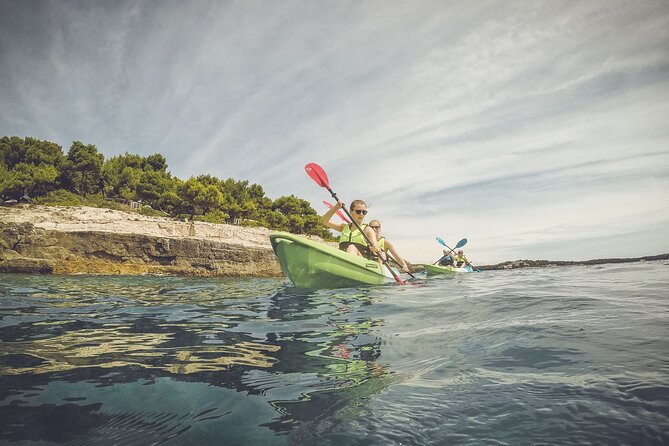 Kayak tour in Pula to Valley of Tears/free drinks+photos included - Snorkeling, swimming, and cliff jumping