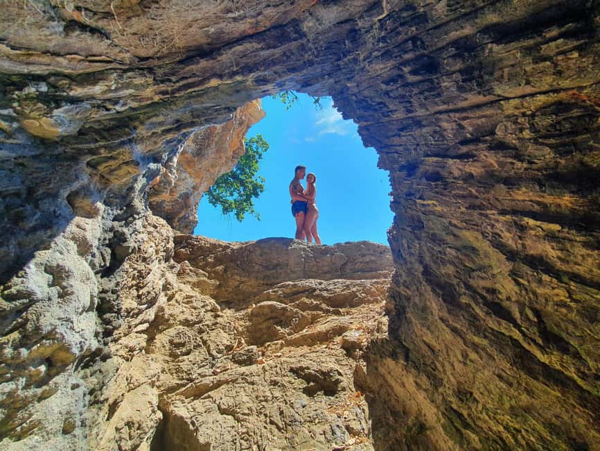 Opatija: Cliffs and caves kayak adventure - Swimming through the small underwater cave