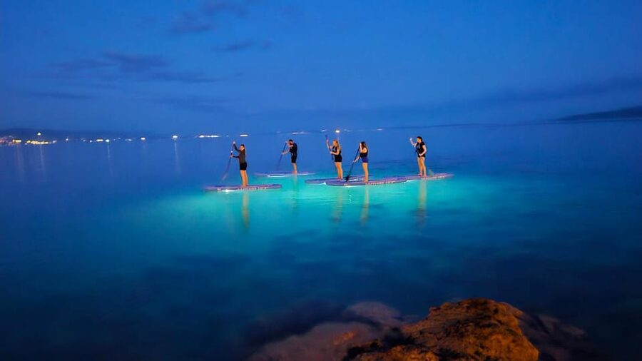Opatija: Guided SUP Paddleboarding Adventure at Night - Churches, hotels, beaches, and parks from the water