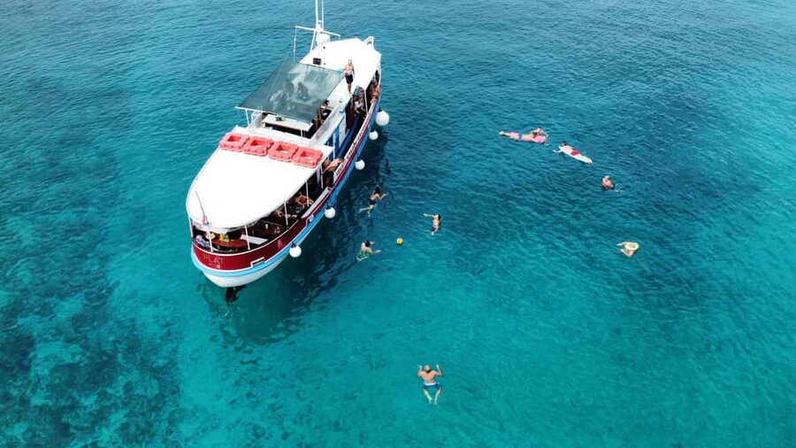 Podstrana: Full-Day Boat Trip to Brač and Shipwreck Kontesa - The first swim stop and onboard BBQ