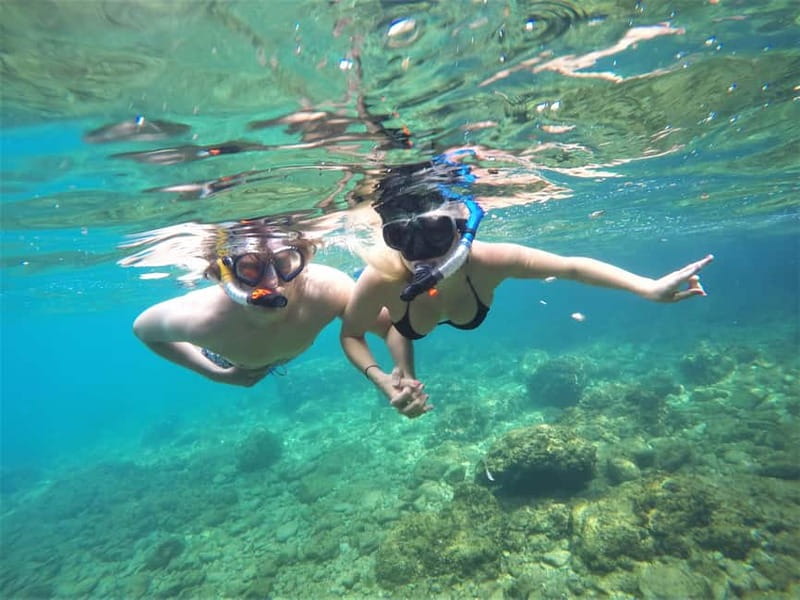 Pula: Cave Kayak Tour, Snorkeling and Island Jumping - Paddling along Pulas rocky coast