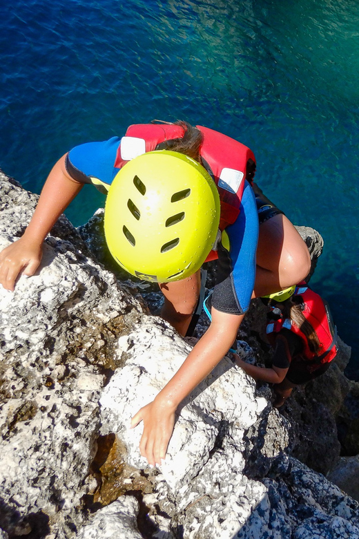 Pula: Coasteering Adventure with Guide and Photos - Swimming and scrambling along Pula’s rocky coast