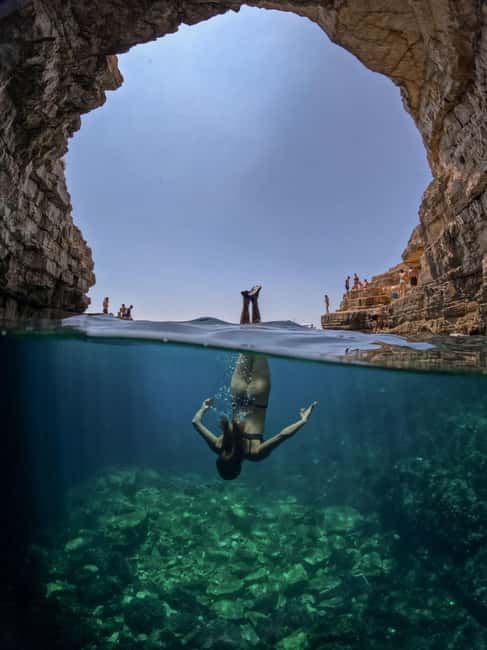 Pula: Kayaking,Snorkeling, Cliff jumping Tour with Wetsuit - Cliff jumping with a camera ready