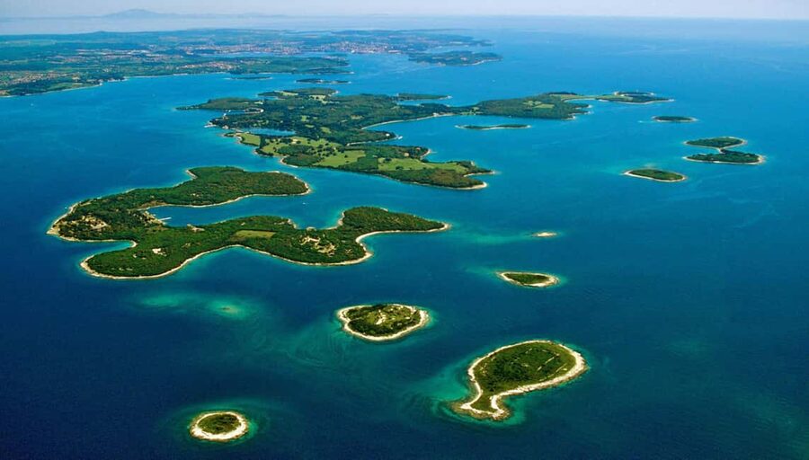 Pula: Private Brijuni Tour With Swimming, Dinner & Drinks - Cruising past Pula’s historic port