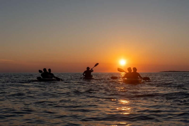 Pula:Sunset Kayak tour with glowing transparent kayak - The Blue Cave viewed from the water