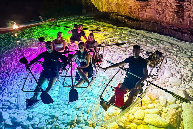 Pula: Sunset/Night-time Illuminated Transparent Kayak Tour - Entering the illuminated cave after dark
